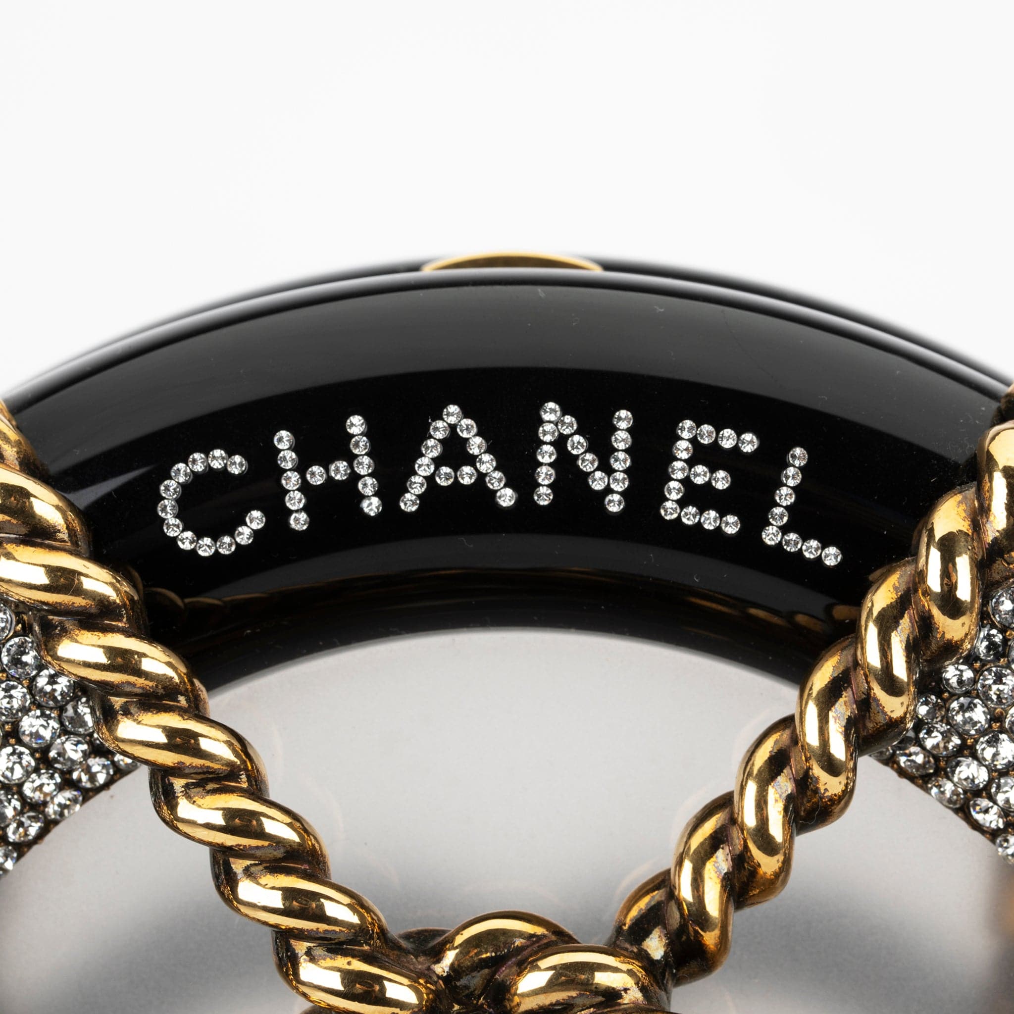 CHANEL MINAUDIÈRE LIMITED EDITION BLACK, GOLD & CLEAR RESCUE WHEEL GOLD-TONE HARDWARE - On Repeat