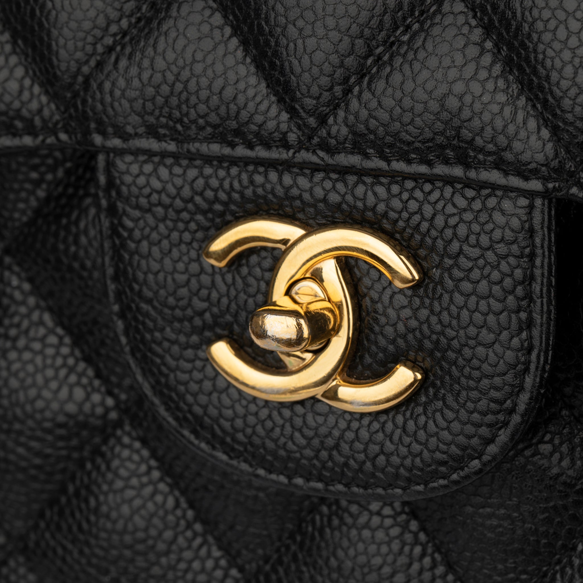 CHANEL CLASSIC JUMBO DOUBLE FLAP BLACK QUILTED CAVIAR LEATHER GOLD-TONE HARDWARE - On Repeat