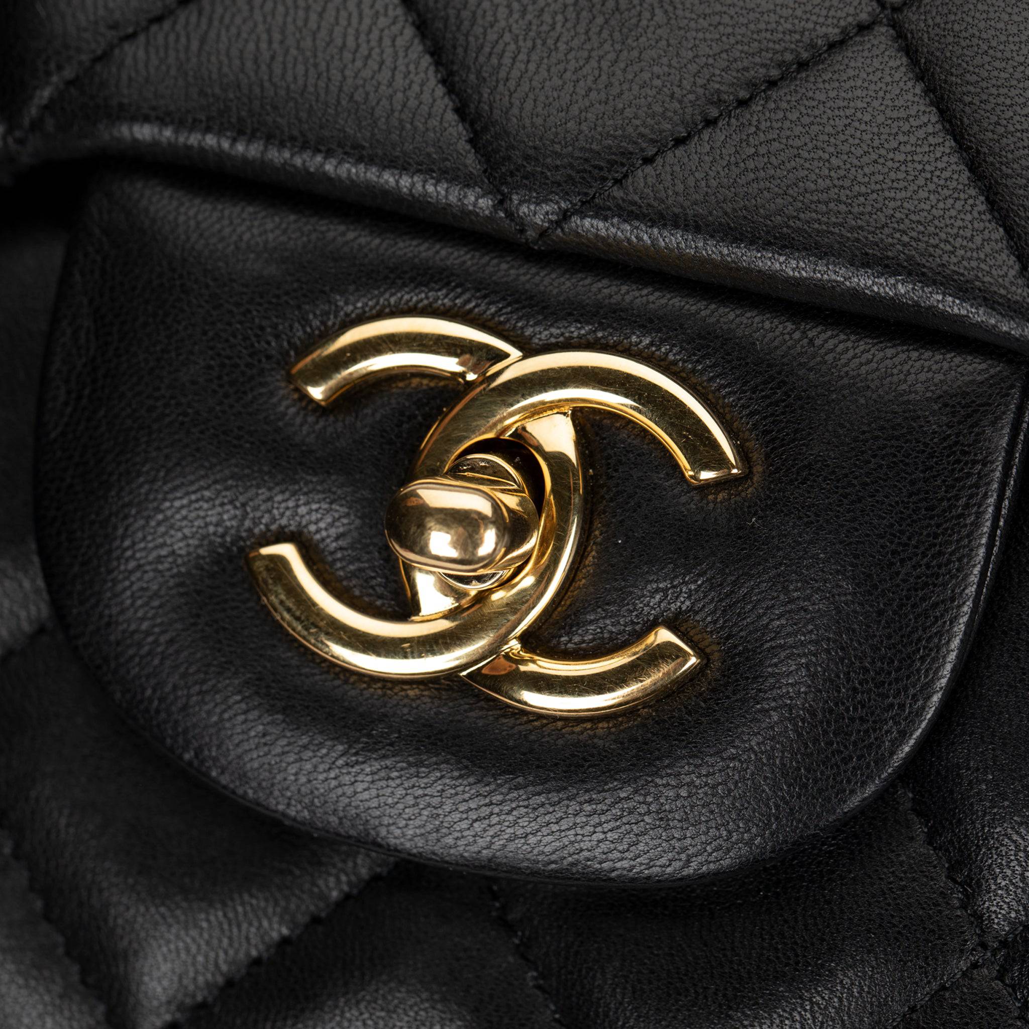 CHANEL MAXI CLASSIC FLAP BLACK QUILTED LAMBSKIN LEATHER GOLD-TONE HARDWARE - On Repeat