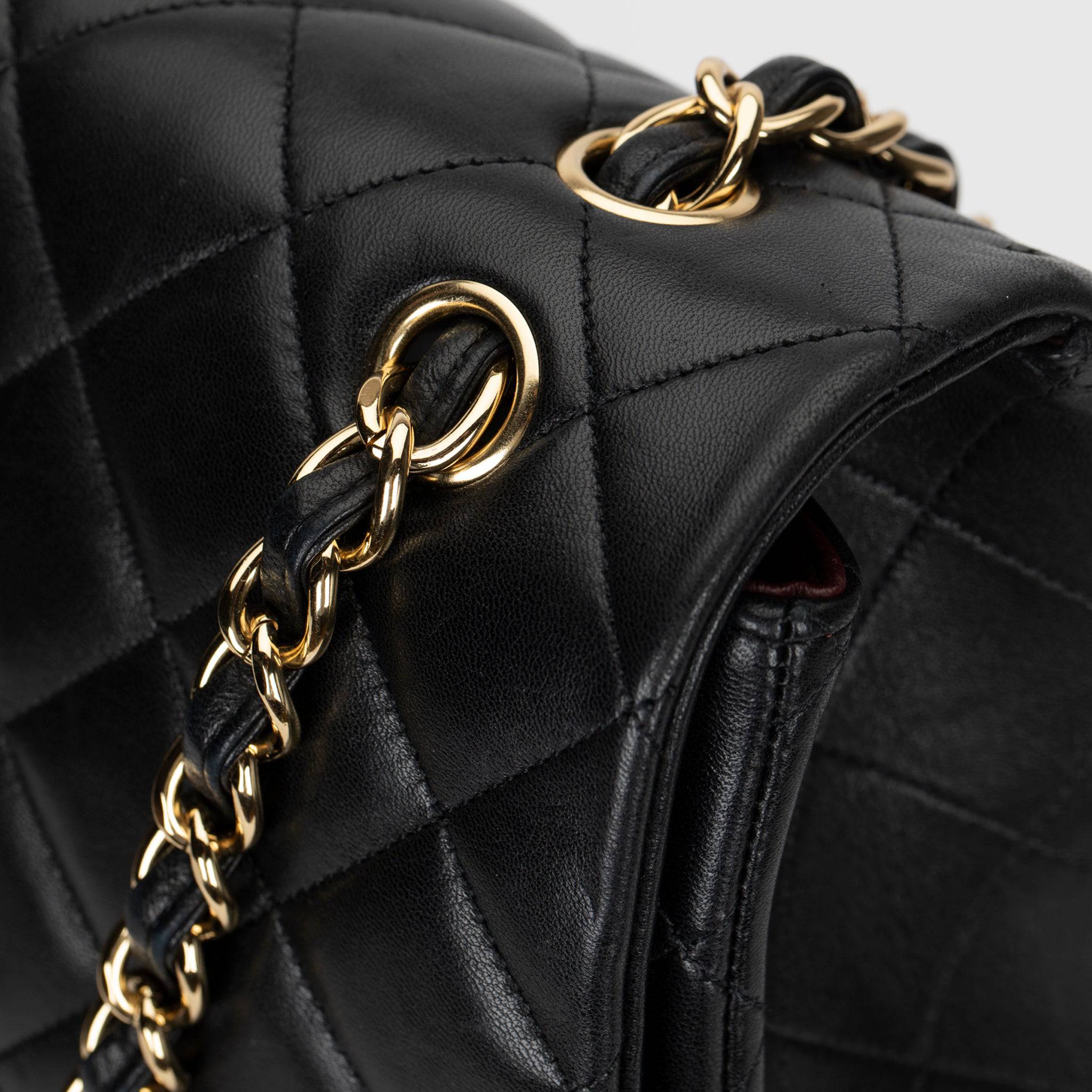 CHANEL MAXI CLASSIC FLAP BLACK QUILTED LAMBSKIN LEATHER GOLD-TONE HARDWARE - On Repeat